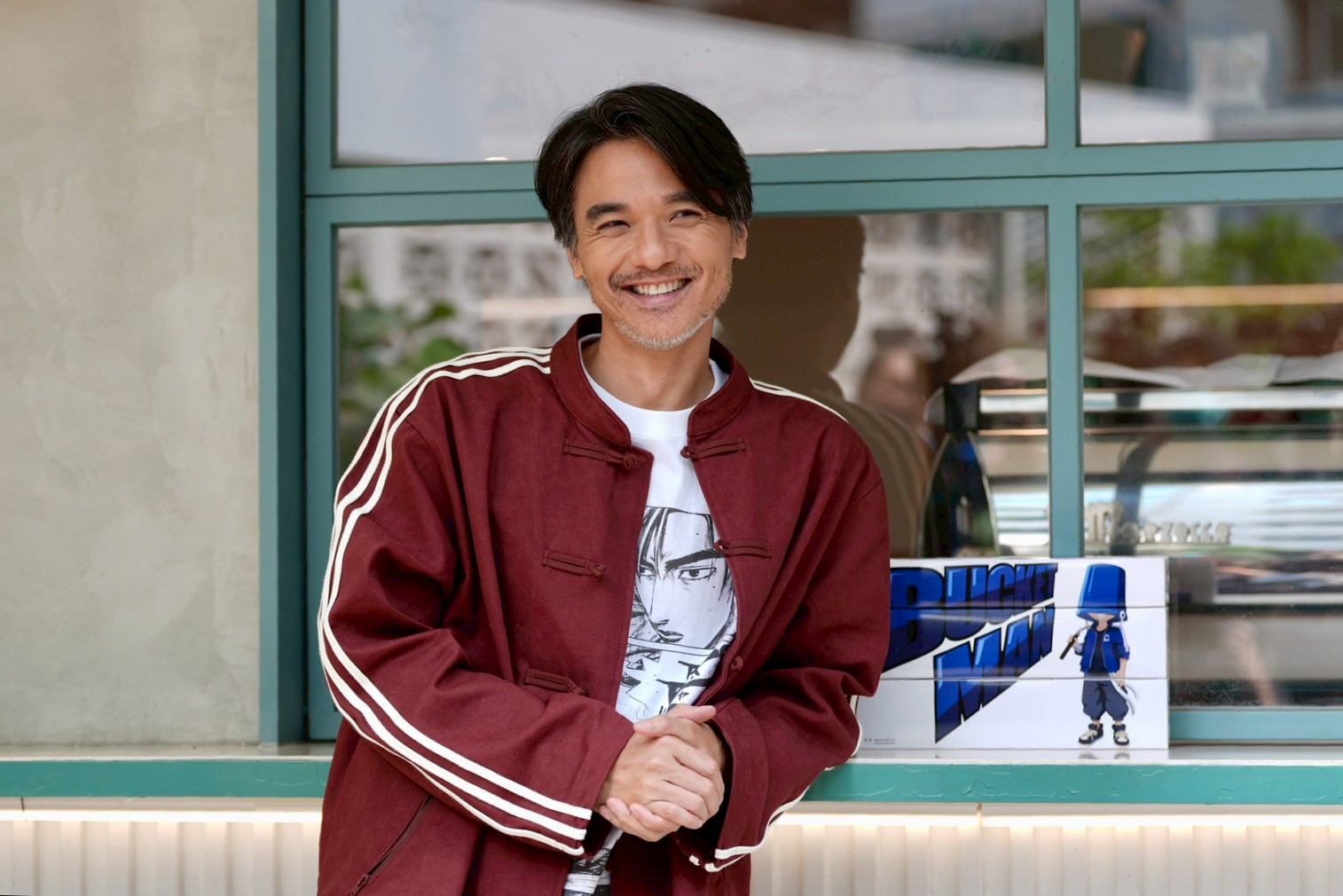 馮德倫熱愛動漫,身上穿的也是頭文字D的T恤。(圖/記者陳明中攝)