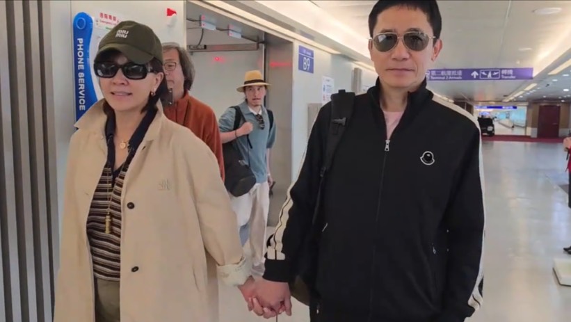 梁朝偉(右)和劉嘉玲十指緊扣來台灣。(圖/讀者提供)